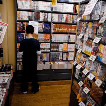 Child looking through books at a bookstore