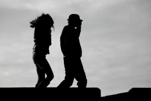 Silhouettes of couple walking