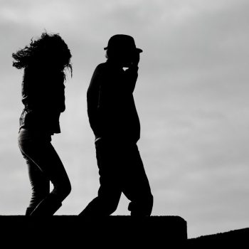 Silhouettes of couple walking