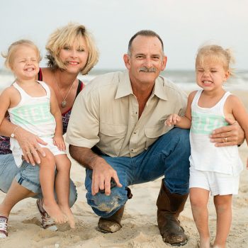 Grandparents with grandchildren on the beach