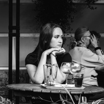 Woman sitting alone at a dining table