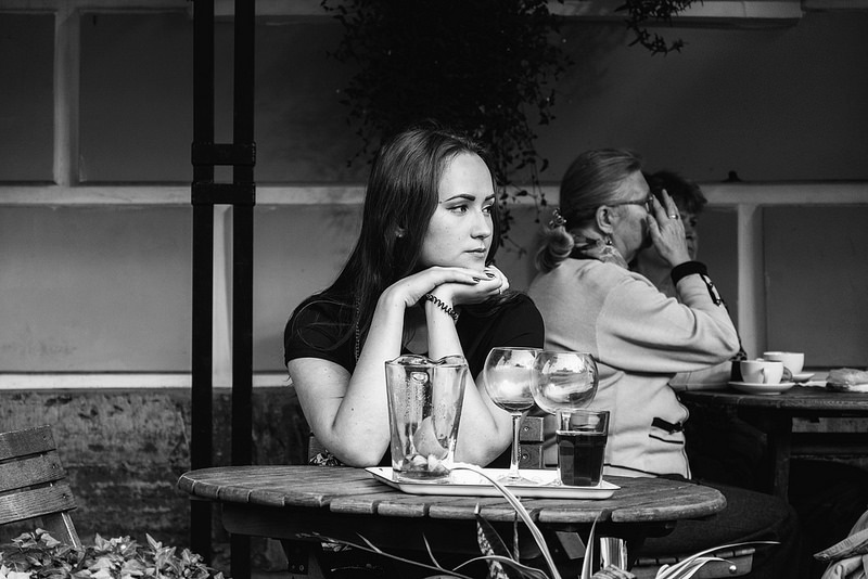 Woman sitting alone at a dining table