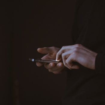 Persons hands holding a phone