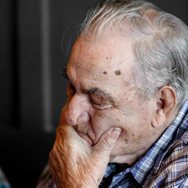dementia close up of elderly man frustrated