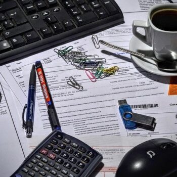 documents and office supplies on desk