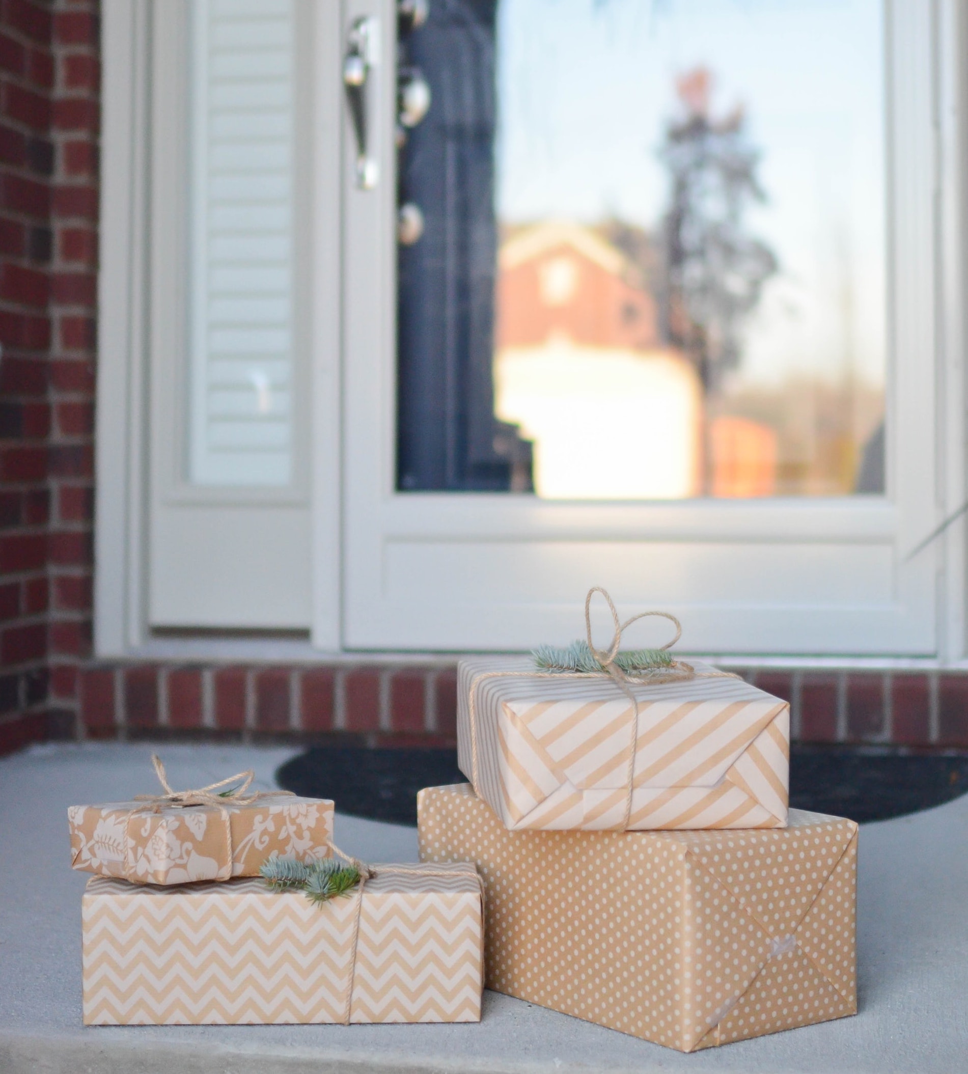 wrapped presents in front of a door