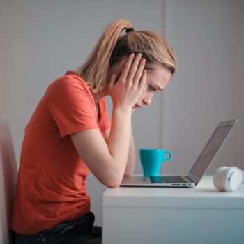 sad woman at computer