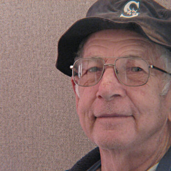 elderly man with small smile