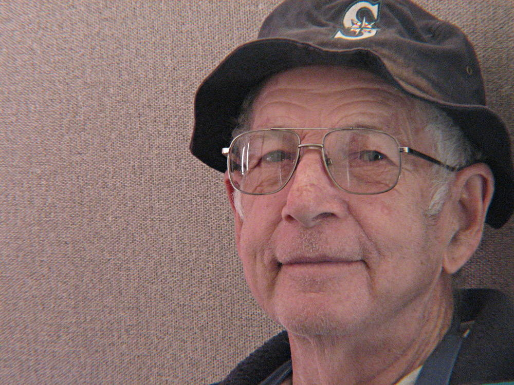 elderly man with small smile