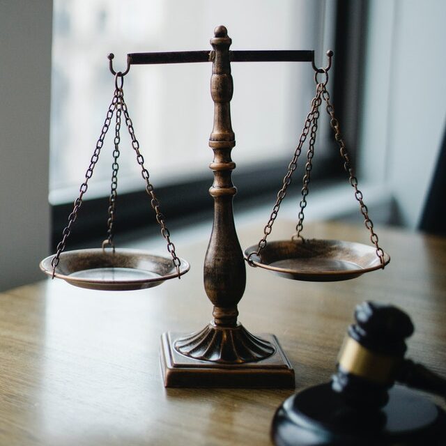 scale and gavel on table