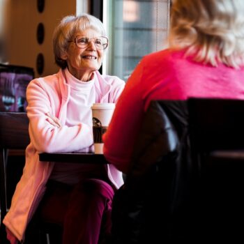 elderly woman at diner with younger woman